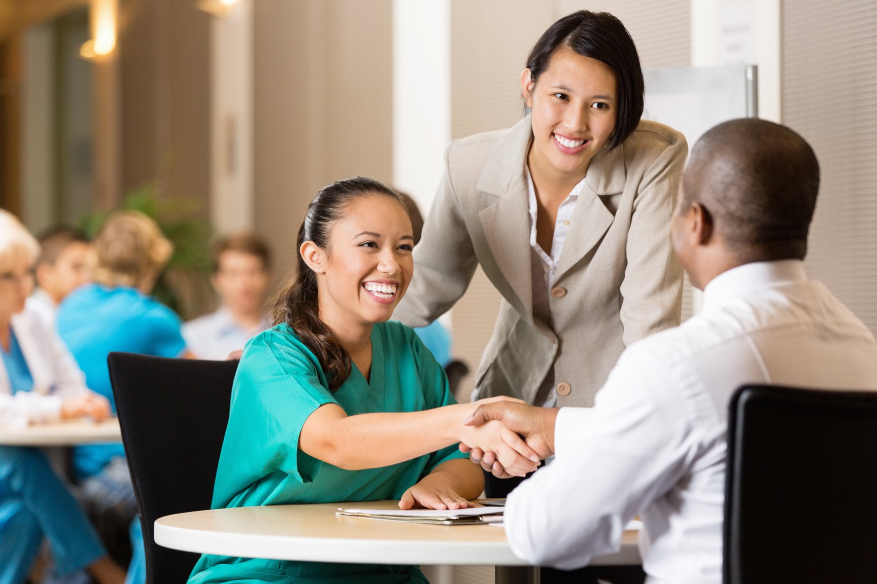 Hospital employee and nurse at job interview